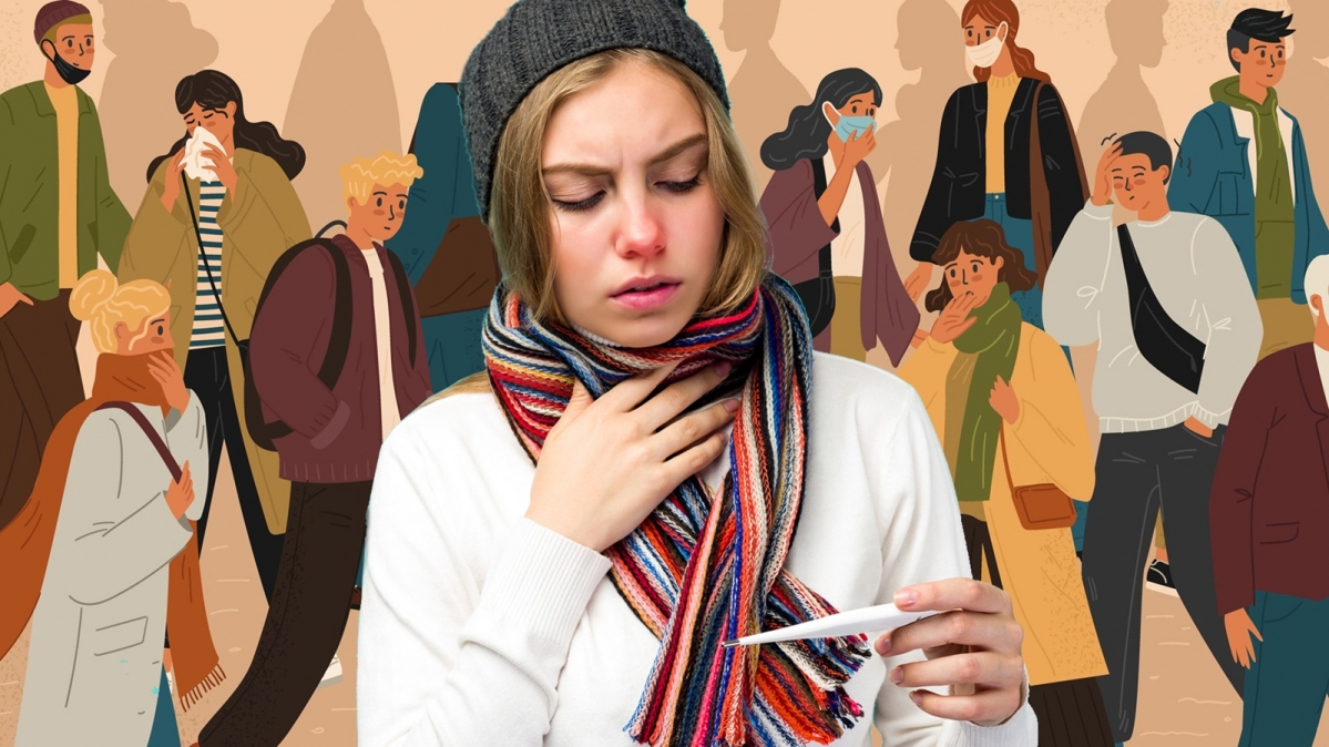 Erkältet junge Frau mit Schal und Fieberthermometer