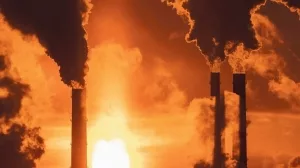 Winter_industrial_landscape._Coal-fired_power_station_with_smoking_chimneys_against_dramatic_sunset_sky._Air_pollution_in_city._Carbon_dioxide_CO2_emissions_as_primary_driver_of_global_climate_change