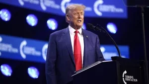 Donald Trump speaking with attendees at the 2023 Turning Point Action Conference at the Palm Beach County Convention Center in West Palm Beach, Florida.